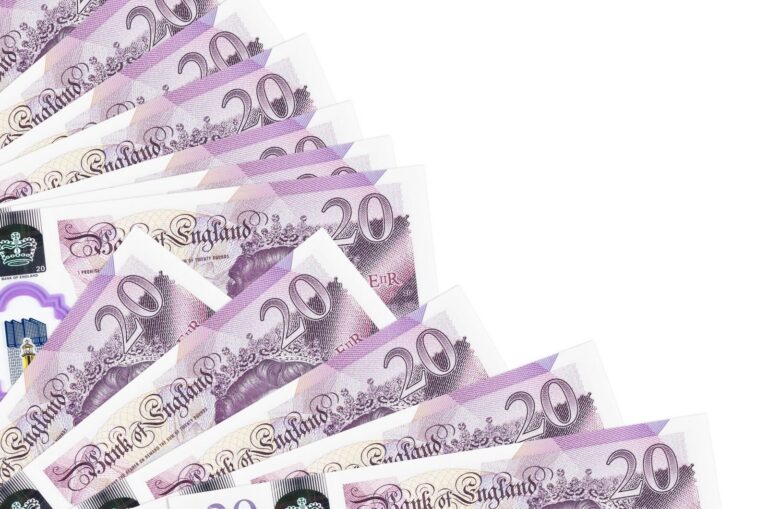 20 british pounds bills lies isolated on white bac 2023 11 27 05 16 39 utc scaled 1