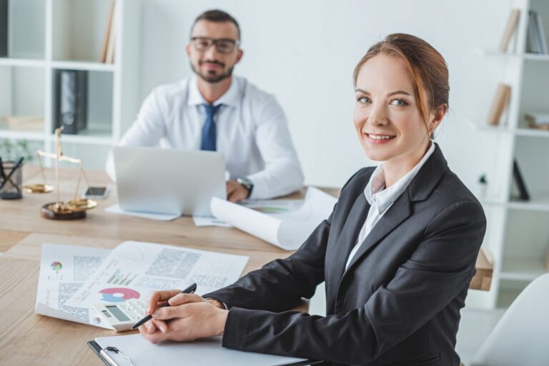 smiling financiers looking at camera in office 2024 11 19 17 39 07 utc